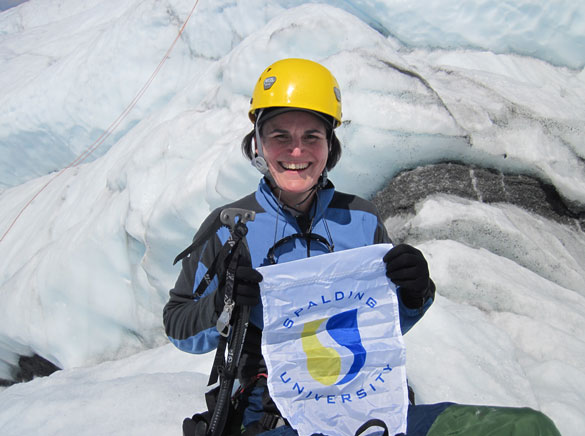 President McClure w/ Spalding banner in Antarctica