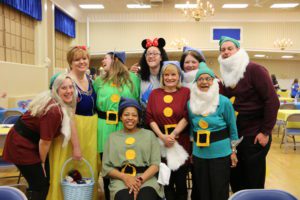 Several members of the Spalding financial aid staff dresssed up as Snow White and the Seven Dwarves, including a couple with long fake white beards