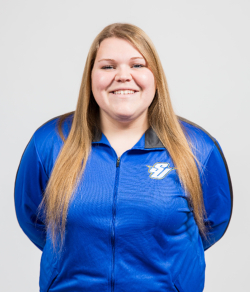 Katie Suiters head shot, wearing blue Spalding track suit