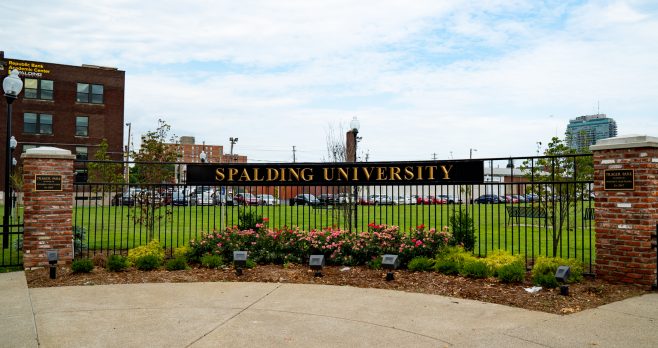 Black iron Trager Park entrance sign that reads "SPALDING UNIVERSITY"