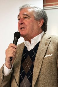 Jerry Abramson holding a microphone and speaking