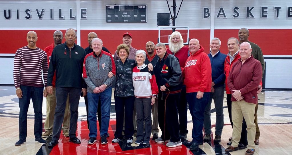 Spalding AD Roger Burkman and several members of the 1980 Louisville basketball team