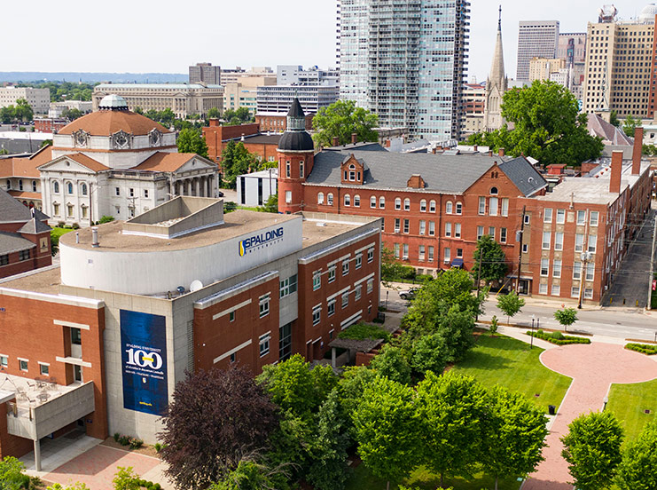 Aerial view of Spalding Egan Leadership Center and Mother Catherine Square with downtown Louisville skyscrapers in background.