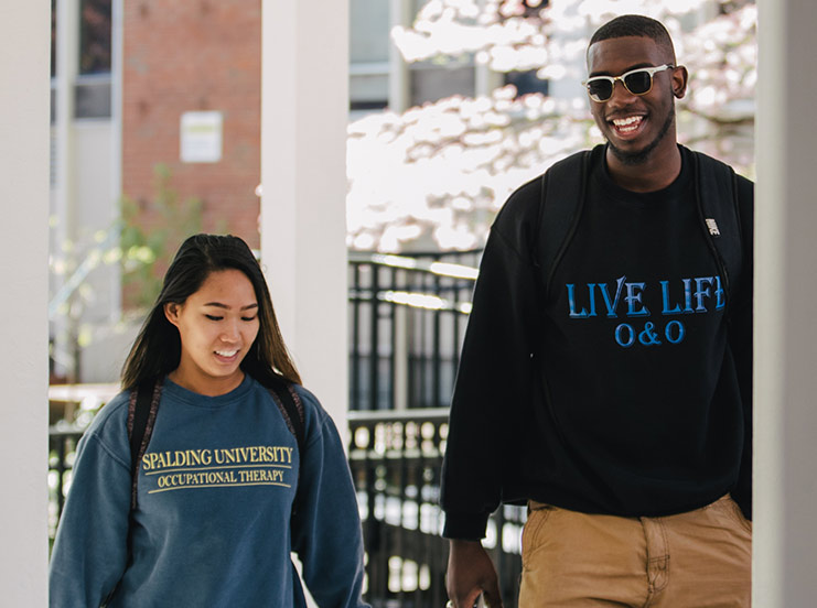 Two Spalding grad students walking