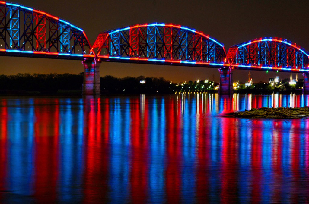 Big Four Bridge lit up red and blue