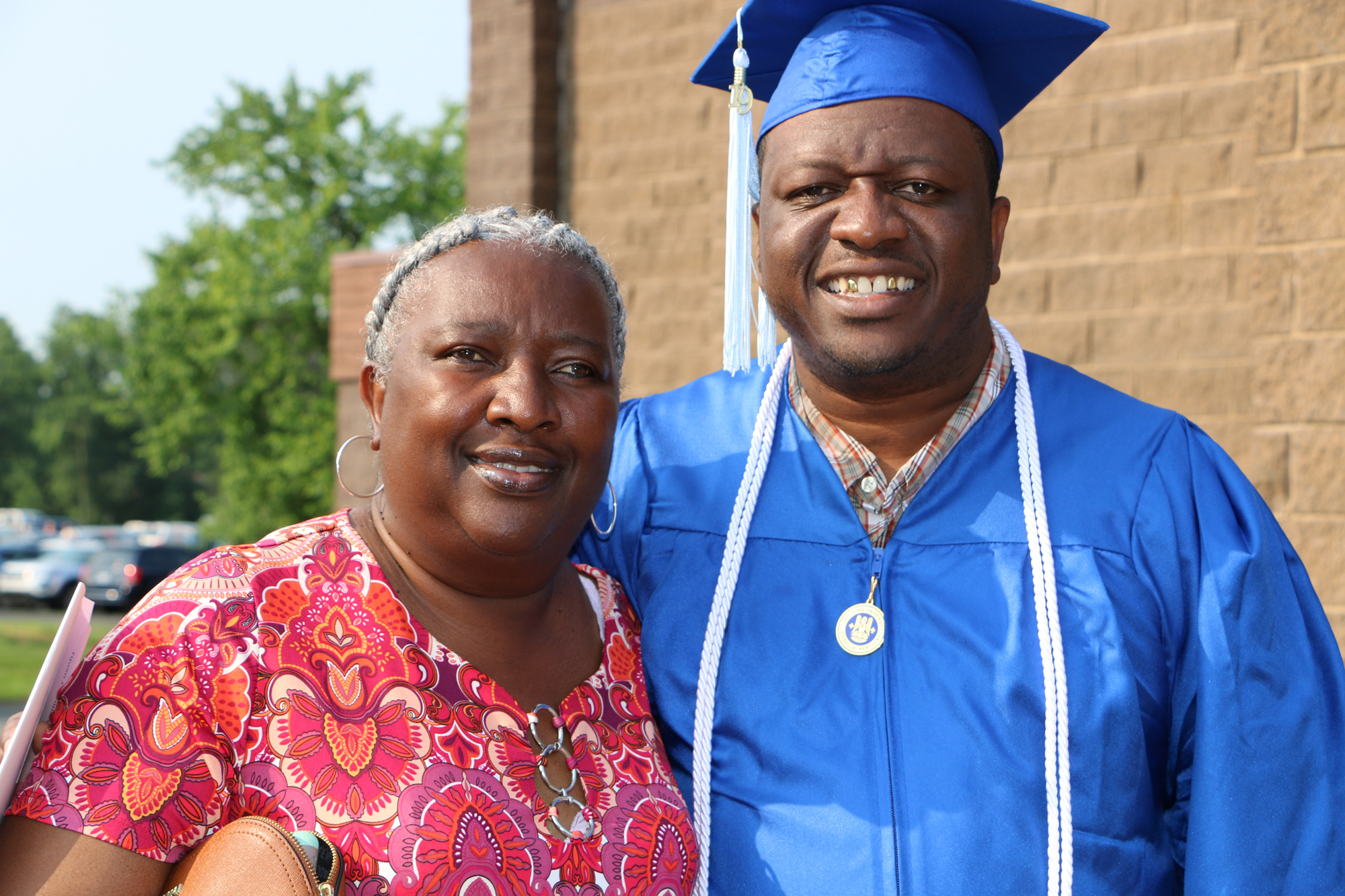 Spalding graduate with family member at Commencement