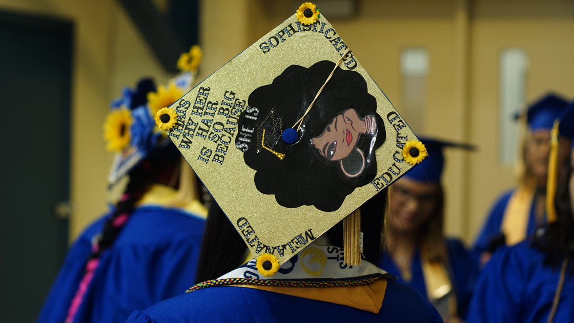 Mortarboard decorated with gold background