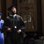 Spalding education graduate holding degree
