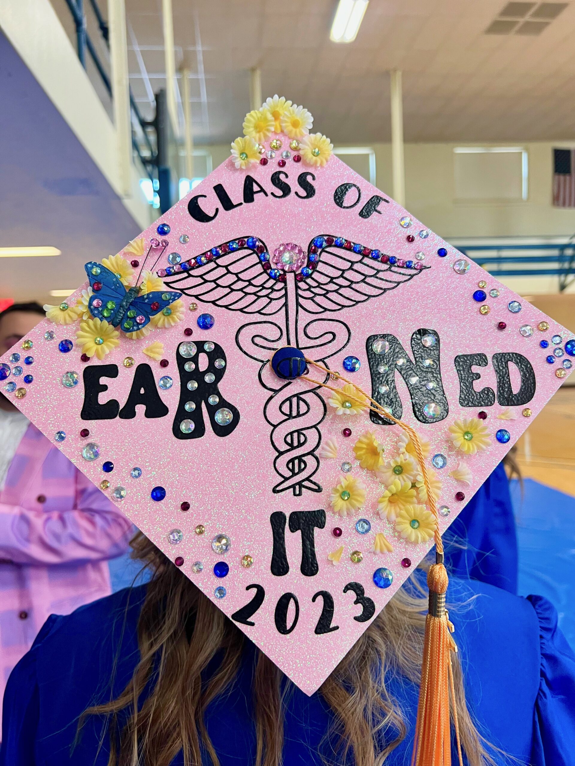 Decorated mortarboard reading "Class of 2023, Earned it"