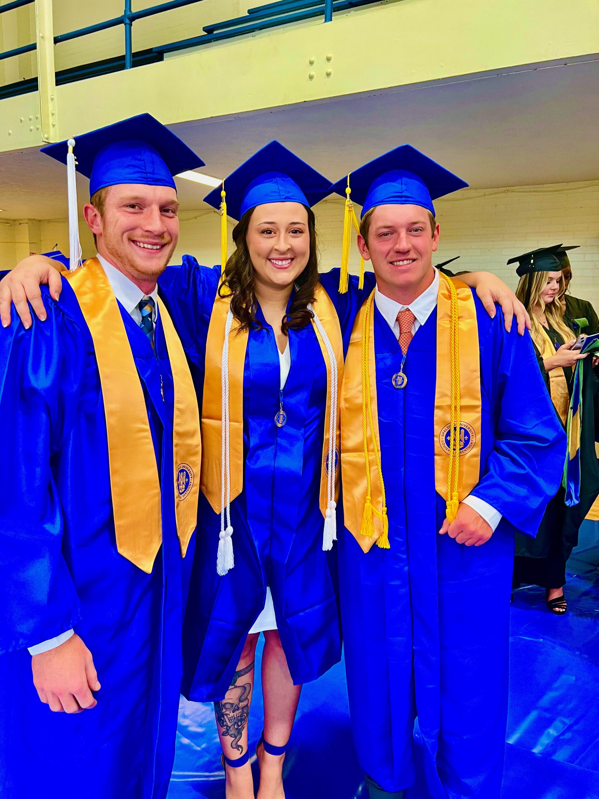 Three Spalding bachelor's graduates
