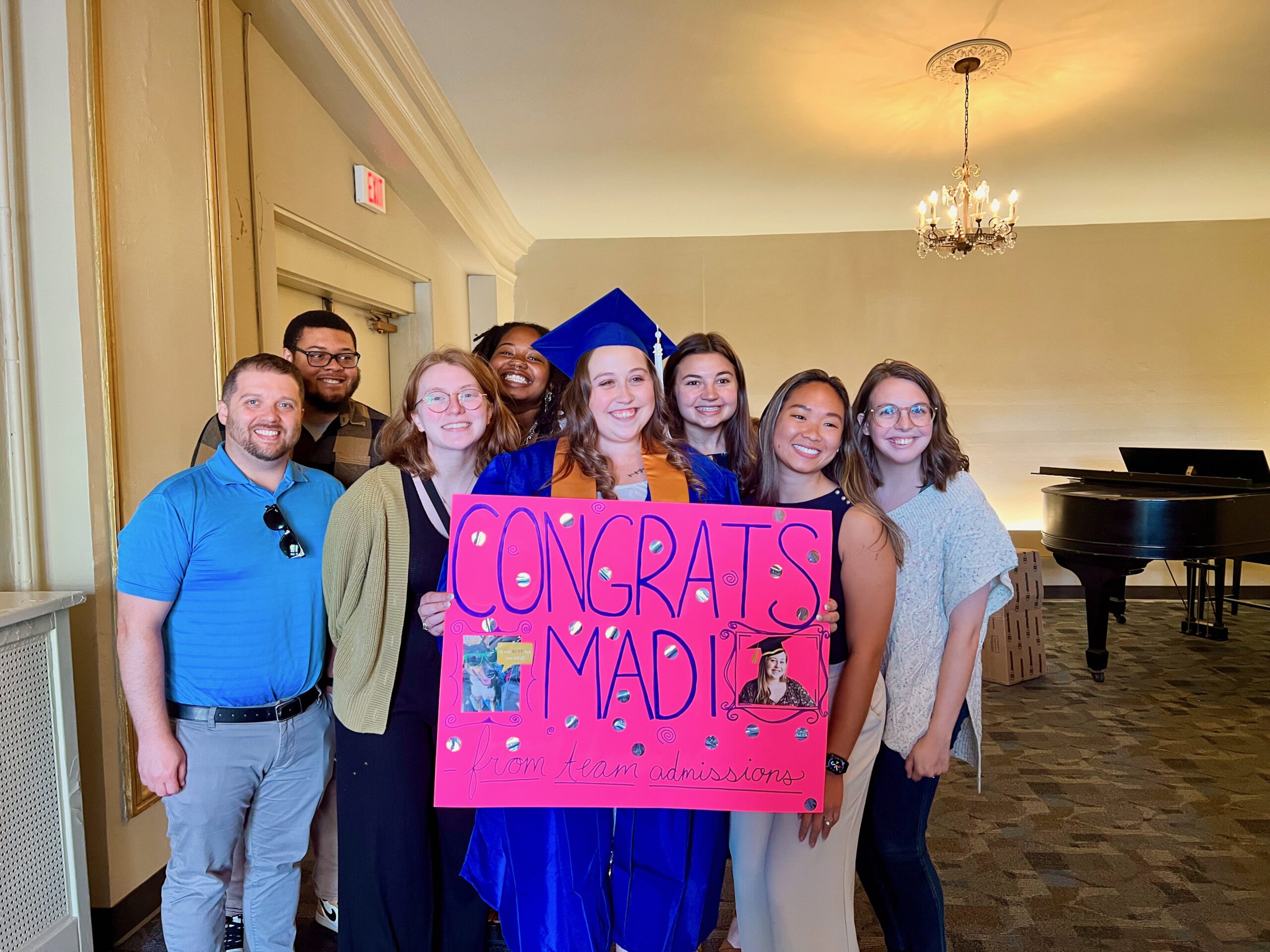 Spalding Admissions Counselor Madi Jaggers after her commencement ceremony with the rest of the Admissions team