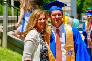 Spalding master's graduate posing for photo with mom