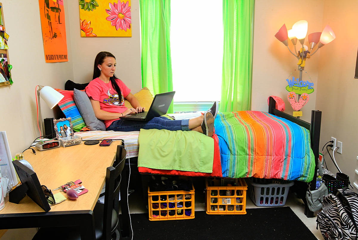 Spalding Suites Bedroom with student bed, desk and under bed storage.