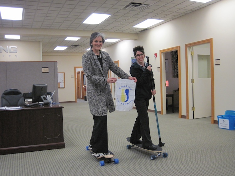 President Tori Murden McClure on skateboard in office