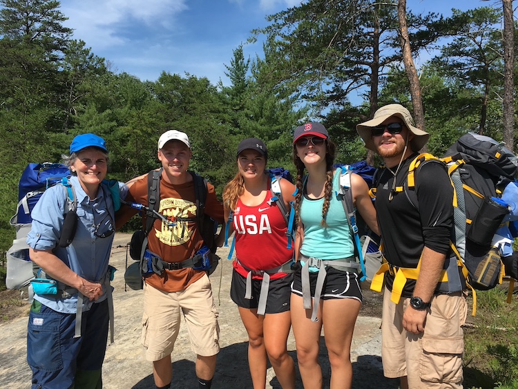 President Tori Murden McClure backpacking with members of Spalding's Student Government Association