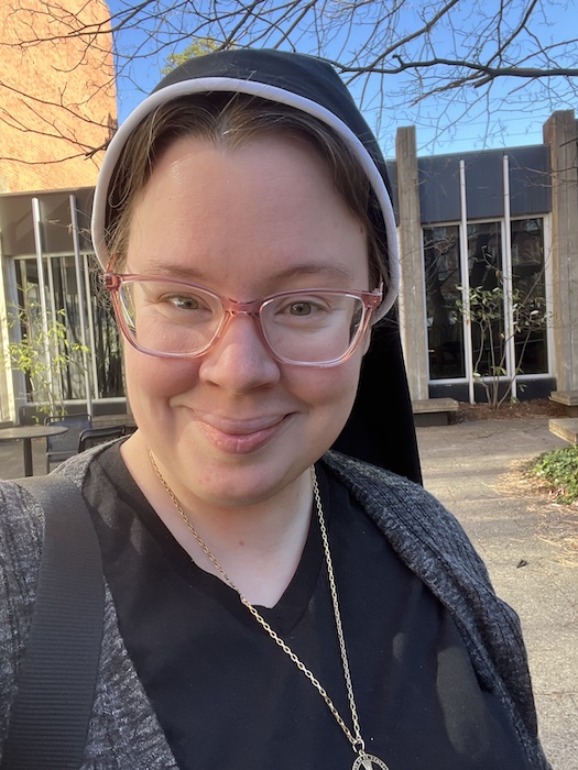 Sister Katie Cummings in front of Spalding University library.