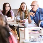 professor teaching small group of students