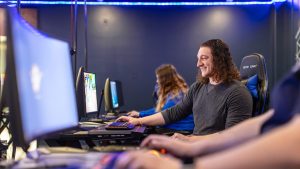 male student on desktop computer
