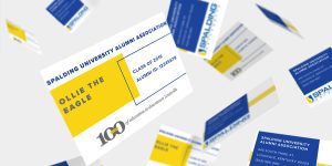 image of a Spalding alumni association yellow and white alumni membership card, similar to business card size with pertinent details printed on it